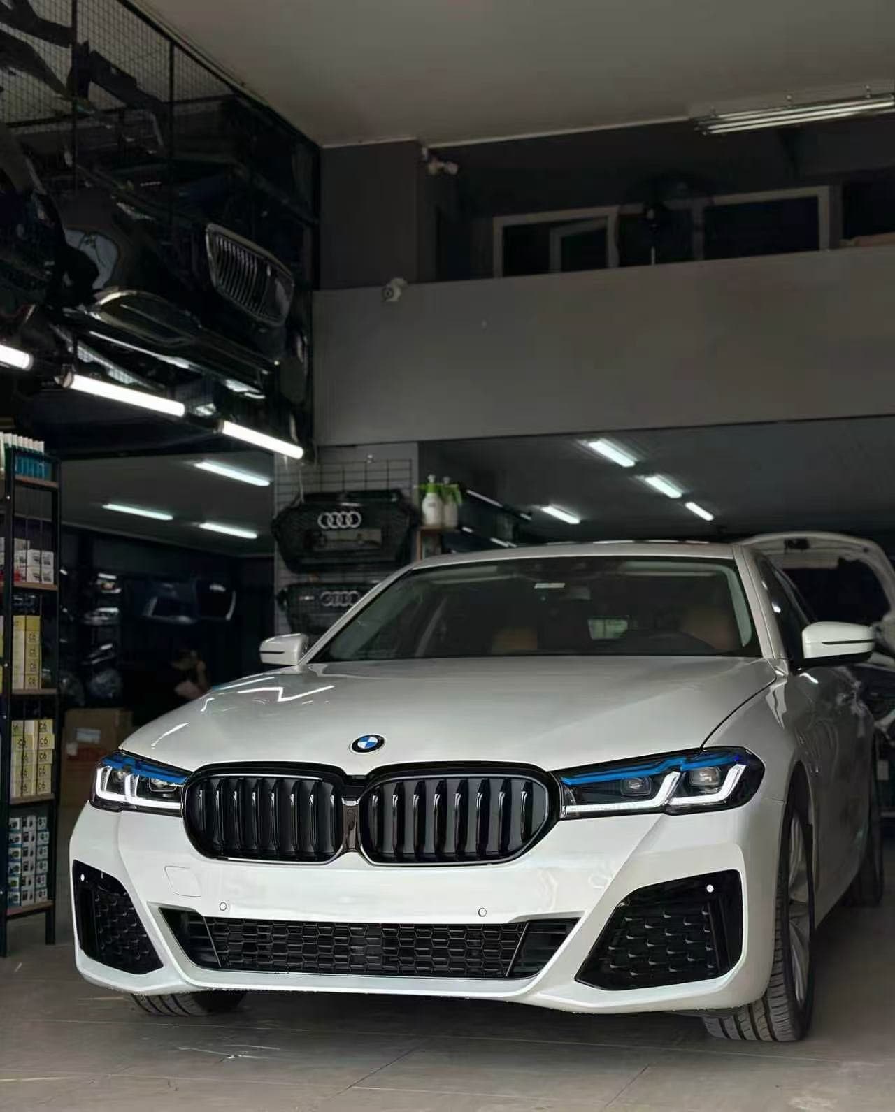 White BMW G30 after its LCI M-Tech-style front conversion