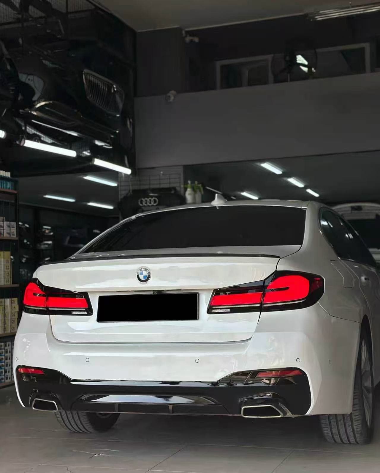 White BMW G30 after its completed rear conversion